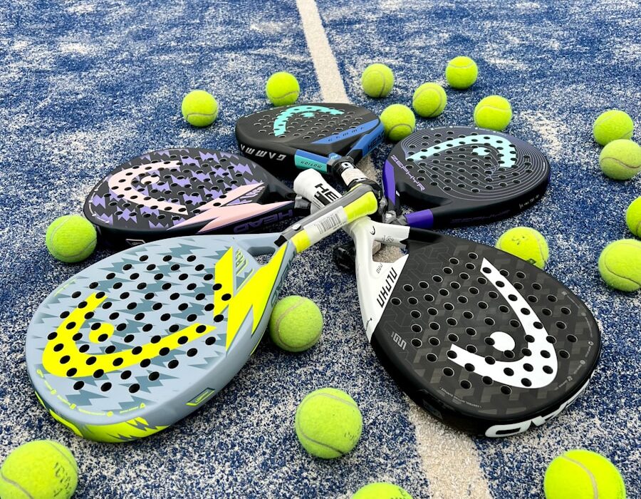 tennis rackets and balls on a tennis court
