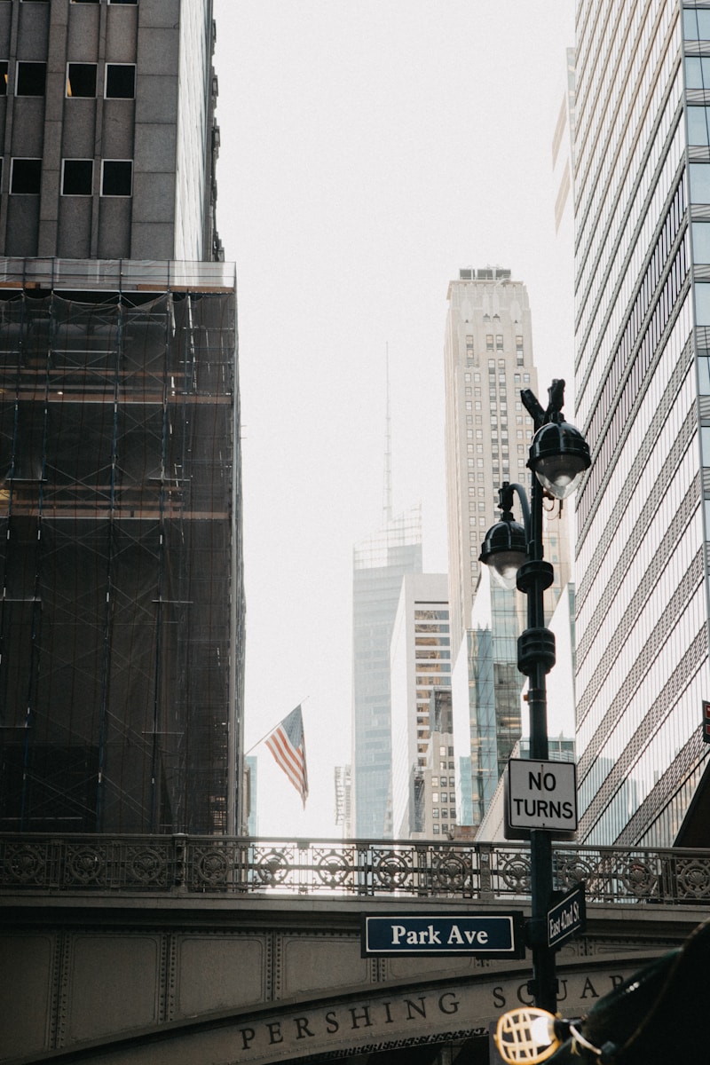 A street sign on the side of a bridge