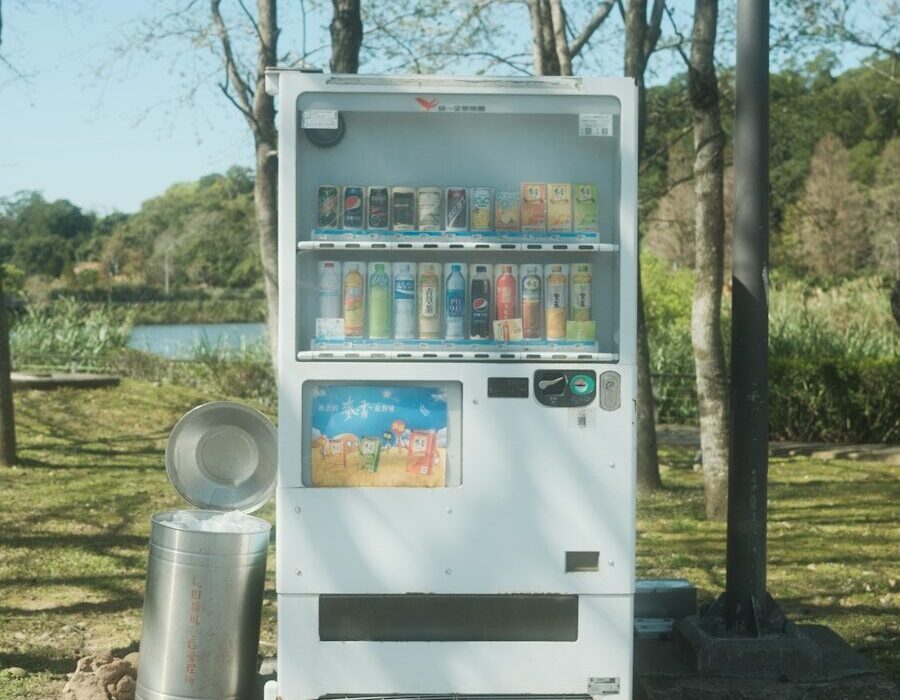 a vending machine sitting on the side of a road